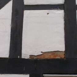 Cracks and removed cement render.