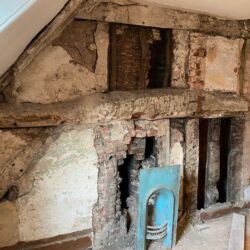 The Victorian fire surround was a later addition that connected with an historic chimney flue.