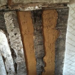 Two layers of clay render was applied onto the oak laths.