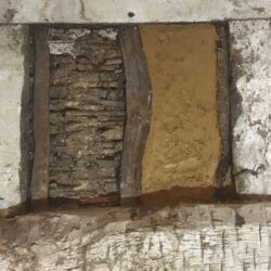 Two coats of clay render were applied over the laths.