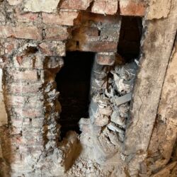 The chimney flue was in a state of disrepair and no longer in use.