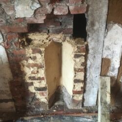 The brickwork cheeks were rebuilt in their original positions.