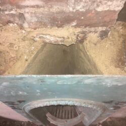 The fire surround was fixed to the brickwork using two 8mm stainless steel threaded bars. The bars were resined onto the back of the cast iron surround and built into the brickwork of the cheeks.