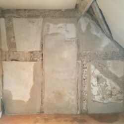 As with the end wall all loose edges of existing plaster were consolidated in two coats against the timber frame. As the plaster dried the surface was finished with a sponge float to provide a slightly textured finish to provide an open surface suitable for the application of limewash. The photo shows the wall in various stages of drying out.