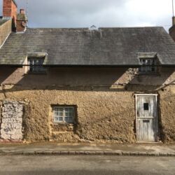 The cement based rendering was removed to show the lower wall was of cob construction and the higher level was built with a modern breeze blocks.