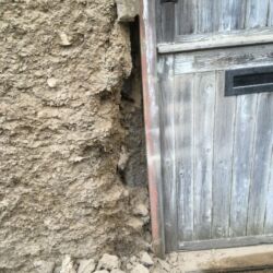 The cob walling was damaged and missing at the side of the doorway.