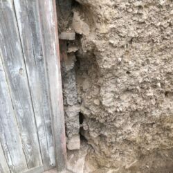 The cob to the right of the door had been damaged by previous door alterations and required repairing.