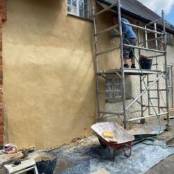 Even though the top of the wall was built with breeze blocks it received the same two coats of lime render.