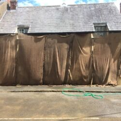 Due to warm spring weather the render was protected from direct sunlight to control the setting of the render, it was also sprayed with water several times a day