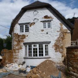The front elevation of the property had been covered with a modern masonry paint. This was cracking and detaching itself from the fabric and the original mortar and stonework behind was deteriorating. it was not allowing the structure to breathe.