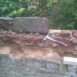 Only loose stones were removed. Stones that were well bedded were left in position.