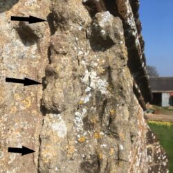 Arrows point at the niche detaching from the main wall. This area was pinned and grouted.