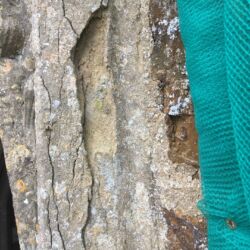 Voids and cracks in the stonework caused by stones laid out of bed.