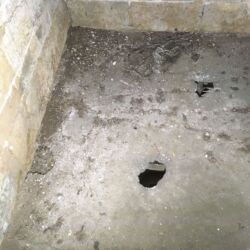 Due to a period in the buildings history when the building was roofless rain had eroded areas of the second floor lime mortar flooring. The areas adjacent to the voids maybe weakened. To minimise loss of the original floor the areas were repaired from beneath