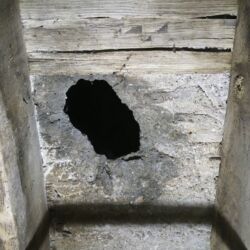 Again looking upwards from the floor beneath in between the floor joists. There is an obvious hole in the floor, but here the original laths that supported the floor had rotted and were missing. The floor is only 45mm thick.