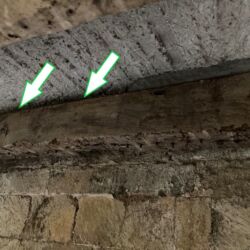 In some areas the laths that had supported the floor originally had rotted and were missing. The arrows points to the gap left by the laths. This gap between the timber and the floor was not supported and left the floor hanging and was liable to further cracking and long term failure.
