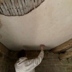 The stairwell ceiling being inspected, this area of the original ceiling was sound and was left in-situ.