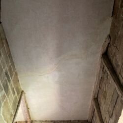 The repaired stairwell ceiling.